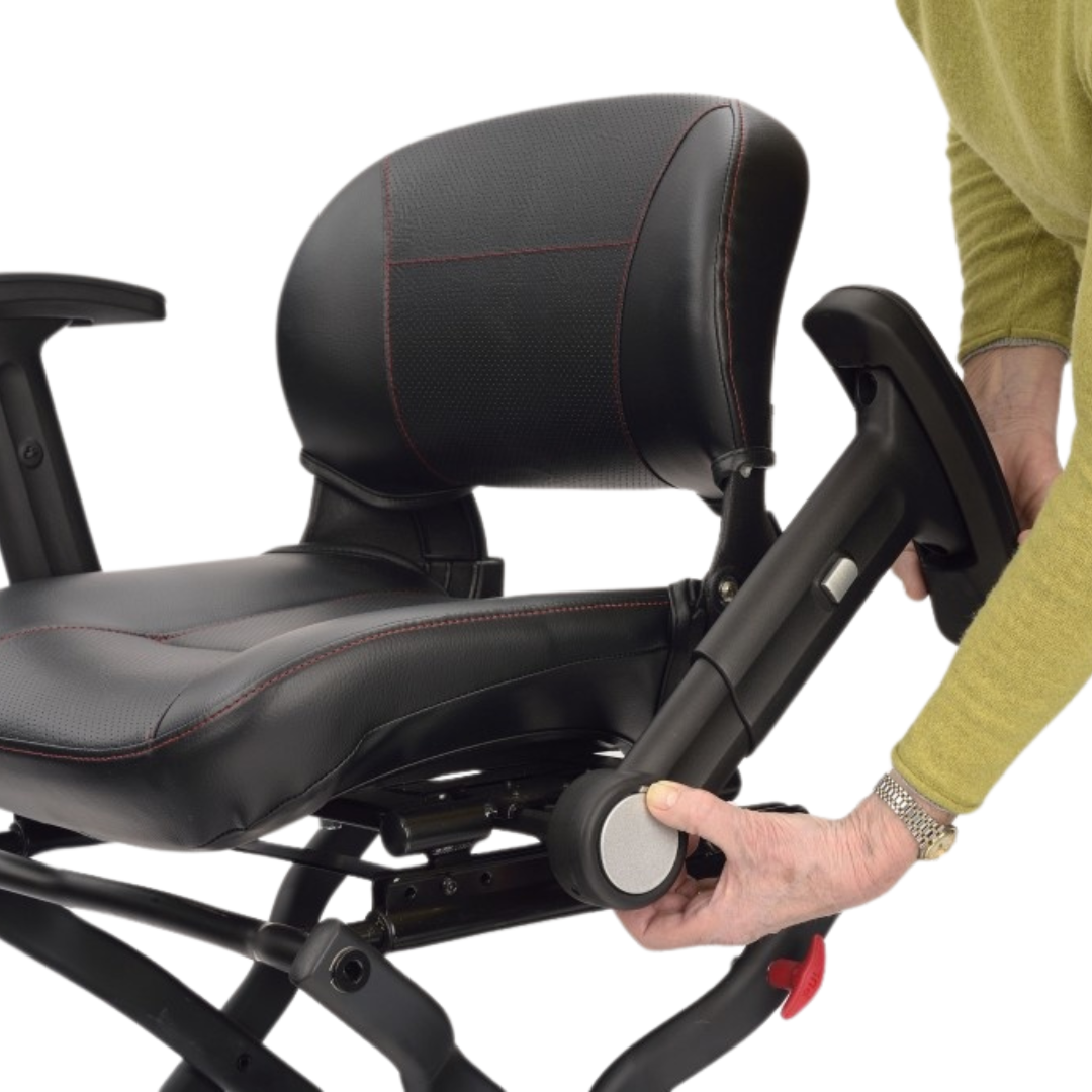 Showing the user reclining the arm rest to allow for side transfer for the user.