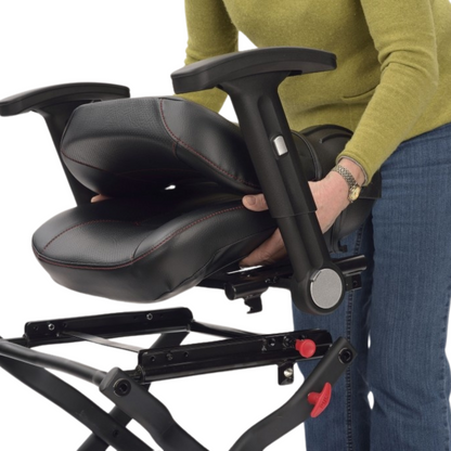 Showing the TGA Maximo Folding Mobility Scooter's seat being removed by the user