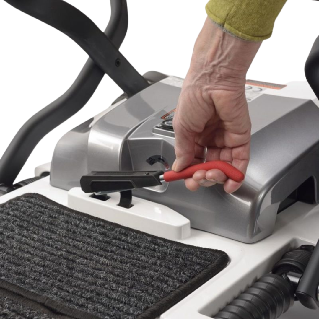 Showing the user pull up on the red lever which allows the scooter to fold.
